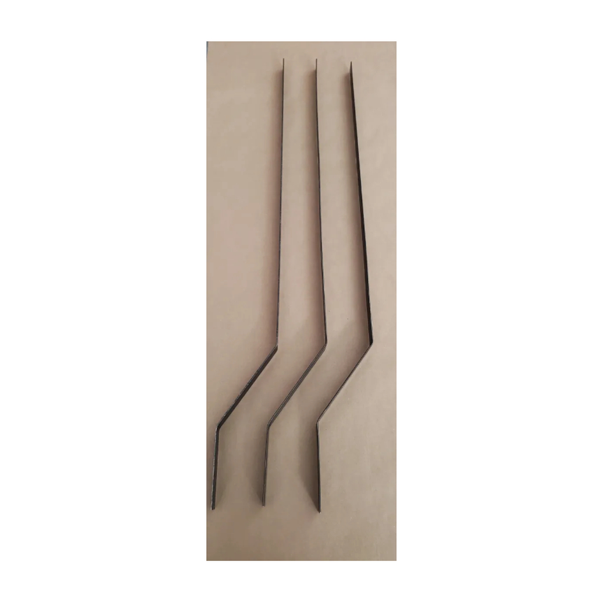 photo of three offset foam blades with a brown background
