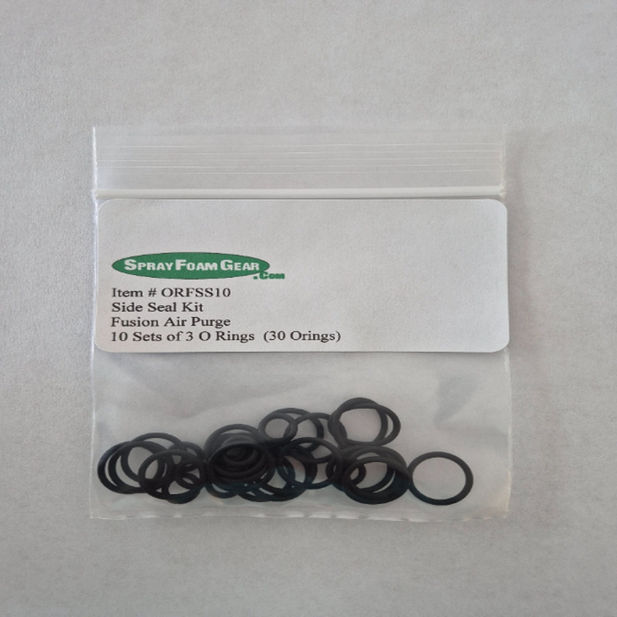 Bag of black O-rings with a label from Spray Foam Gear on a gray background