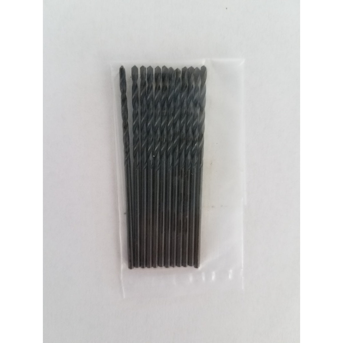Pack of drill bits in a clear plastic bag on a white background