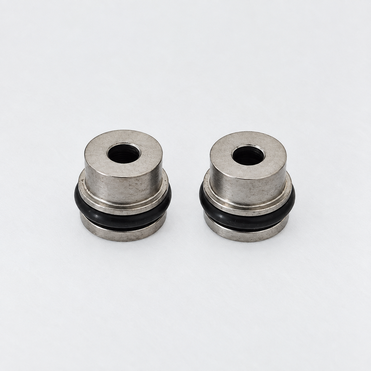 Pair of aftermarket Probler P2 stainless steel side seals with black O-rings for spray foam gun replacement and maintenance.