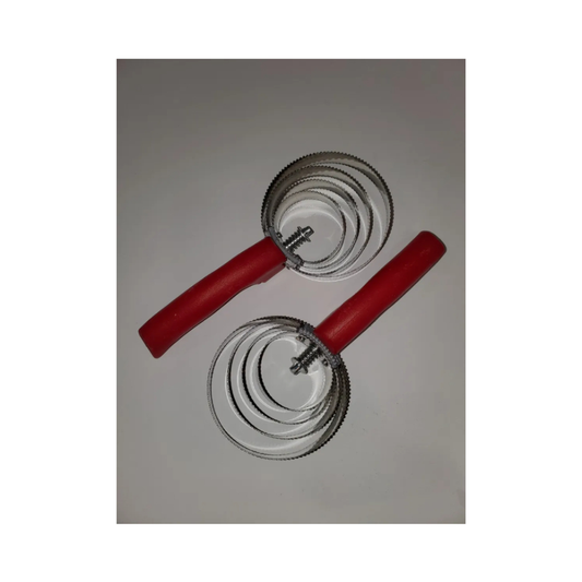 Set of curry combs with red handles on a gray background