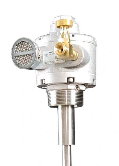 Mechanical pressure gauge with brass valve on a white background