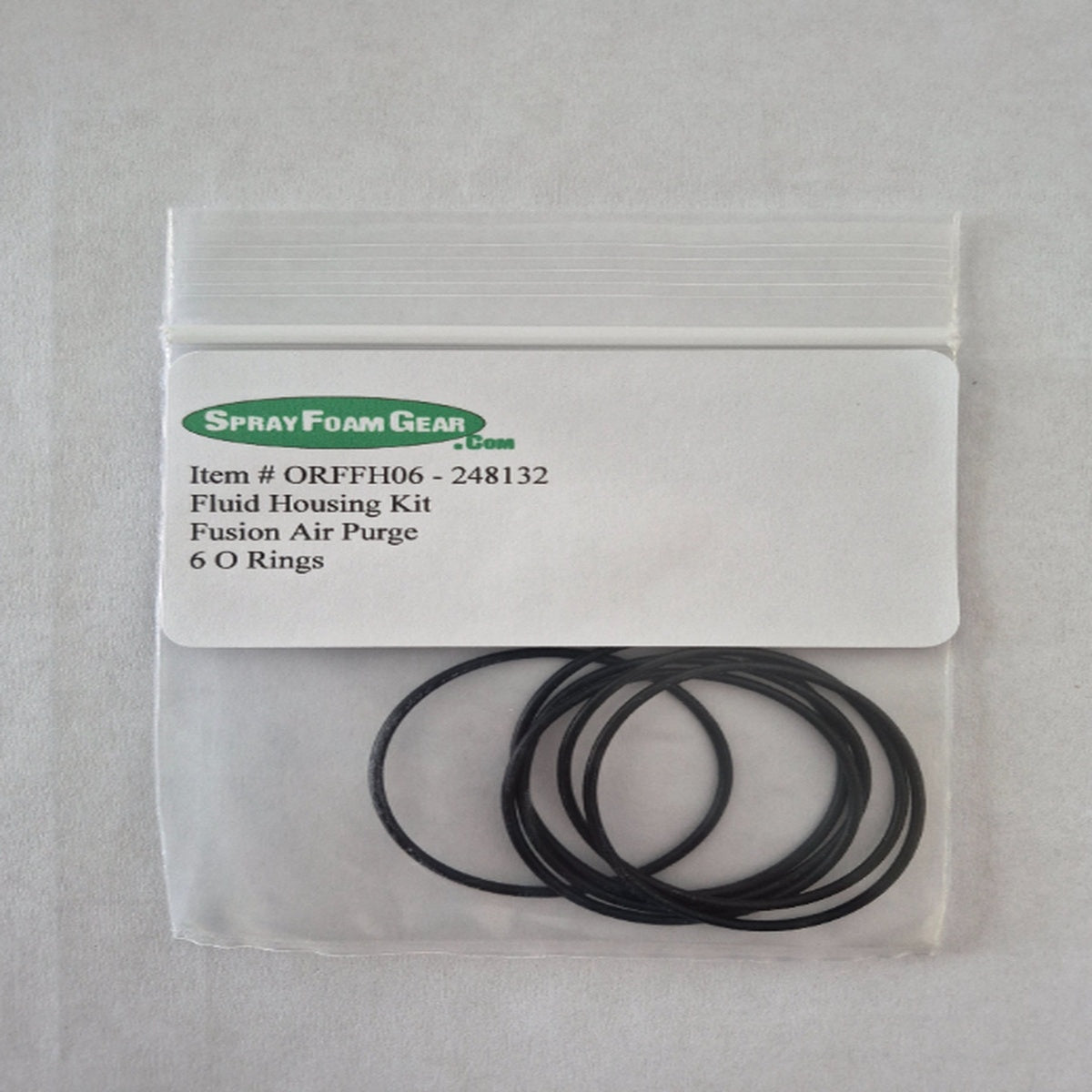 Spray Foam Gear fluid housing kit with 6 O-rings in a clear bag on a gray background