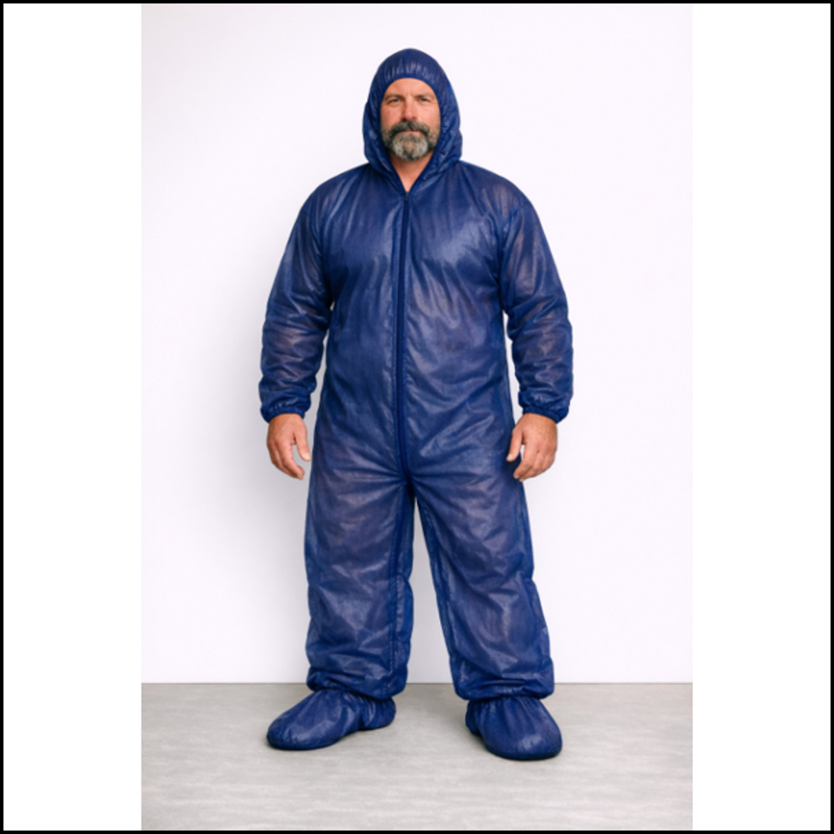 Man wearing a blue protective suit against a white background