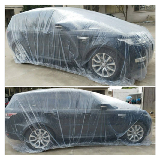 Car covered with a clear plastic wrap on a concrete surface.