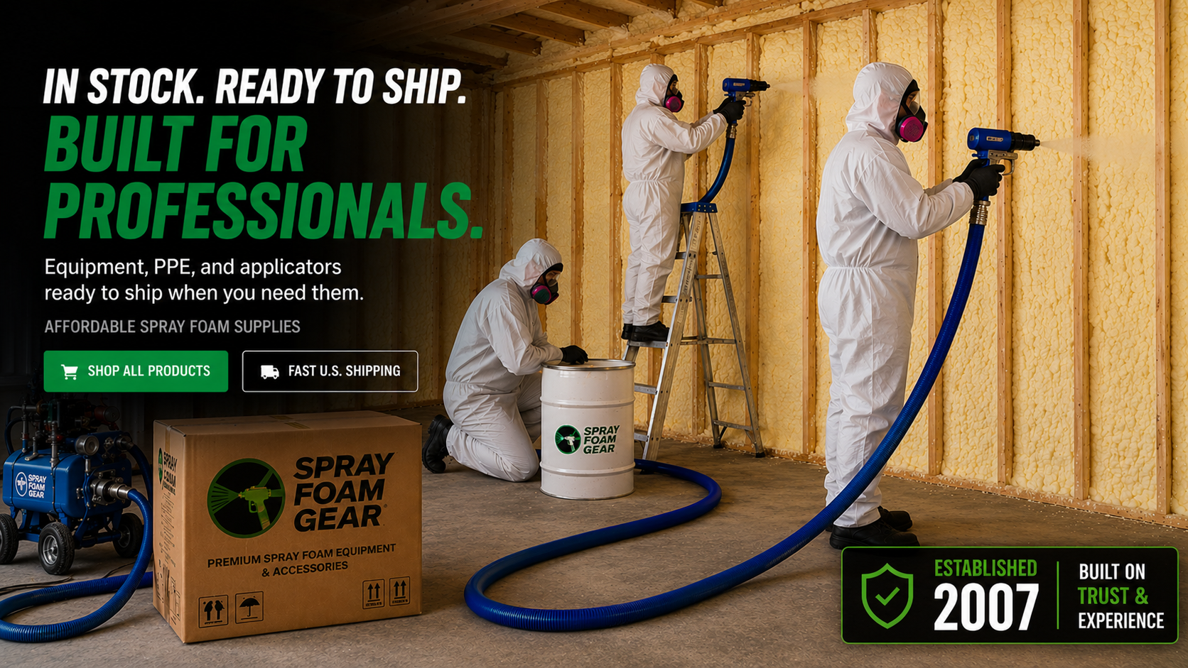 Three people in protective gear working with spray foam equipment in a room with exposed wooden beams.